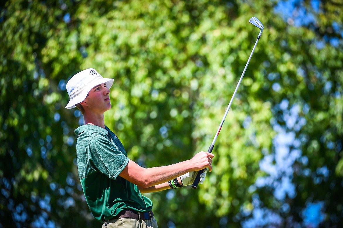 Glacier's Sam Engellant watches his tee shot on the first hole at Village Greens Golf Course on Tuesday, Aug. 29. (Casey Kreider/Daily Inter Lake)