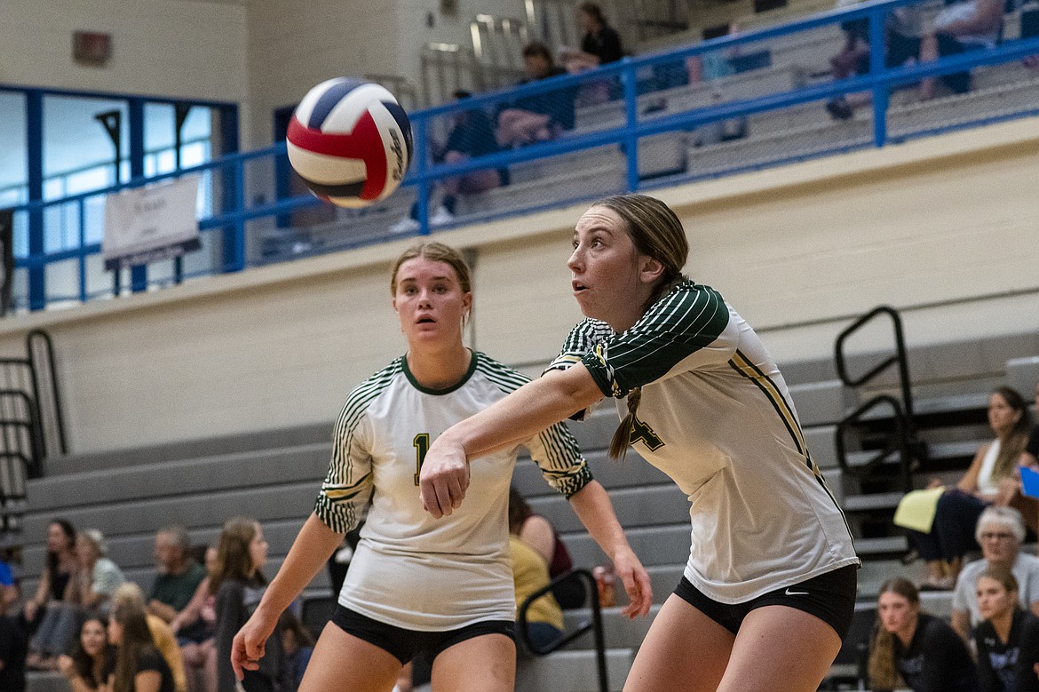 Myli Ridgeway, right, makes a pass as teammate Bailey Smith covers her at the Tip-Off Tournament in Columbia Falls on Friday, Aug. 25. (Avery Howe/Hungry Horse News)