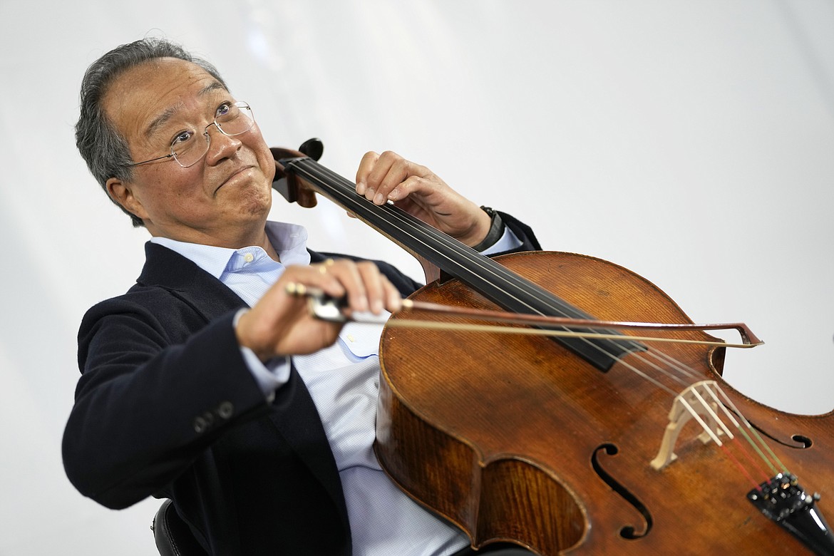 World-renowned US cellist Yo-Yo Ma plays a solo at the Music School of the National Conservatory in Lisbon on March 29, 2022.(AP Photo/Armando Franca)
