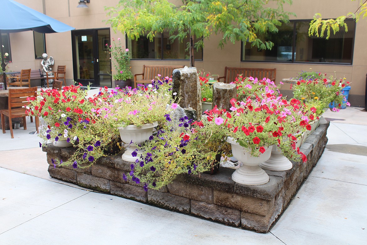 The garden in the Coulee Medical Center courtyard. A volunteer helps care for the garden.