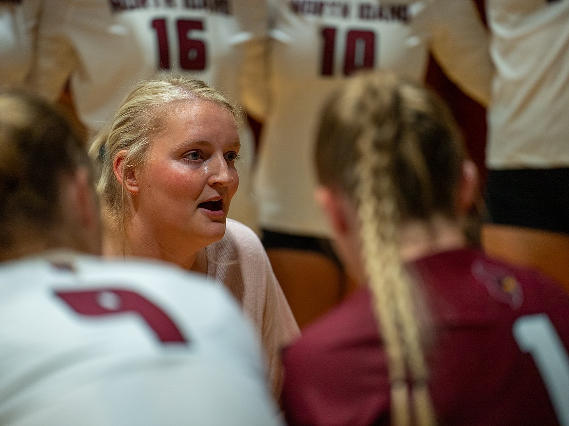 Courtesy photo
First-year North Idaho College coach Brittany Tilleman, who played for the Cardinals in 2013 and 2014, talks to her team during a timeout during Tuesday's match against Bellevue at Christianson Gymnasium.