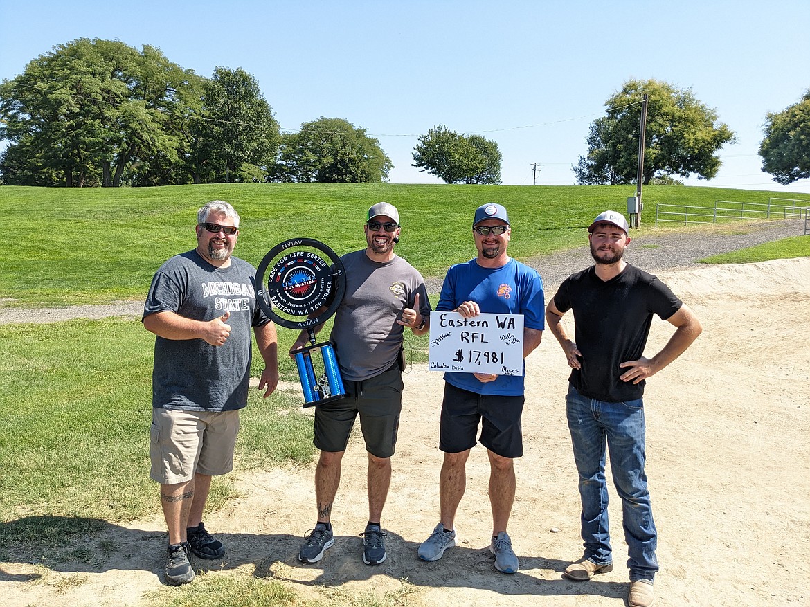 Spokane BMX Track Operator Kory Bartel, left, Columbia Basin BMX Track Operator Sam McPeak, center left, Moses Lake BMX Track Operator Jeff Niehenke, center right, and Walla Walla BMX Track Operator Alex Forss smile at the Walla Walla BMX track on Sunday.  The Eastern Washington Race for Life Series raised nearly $18,000 between the four tracks.