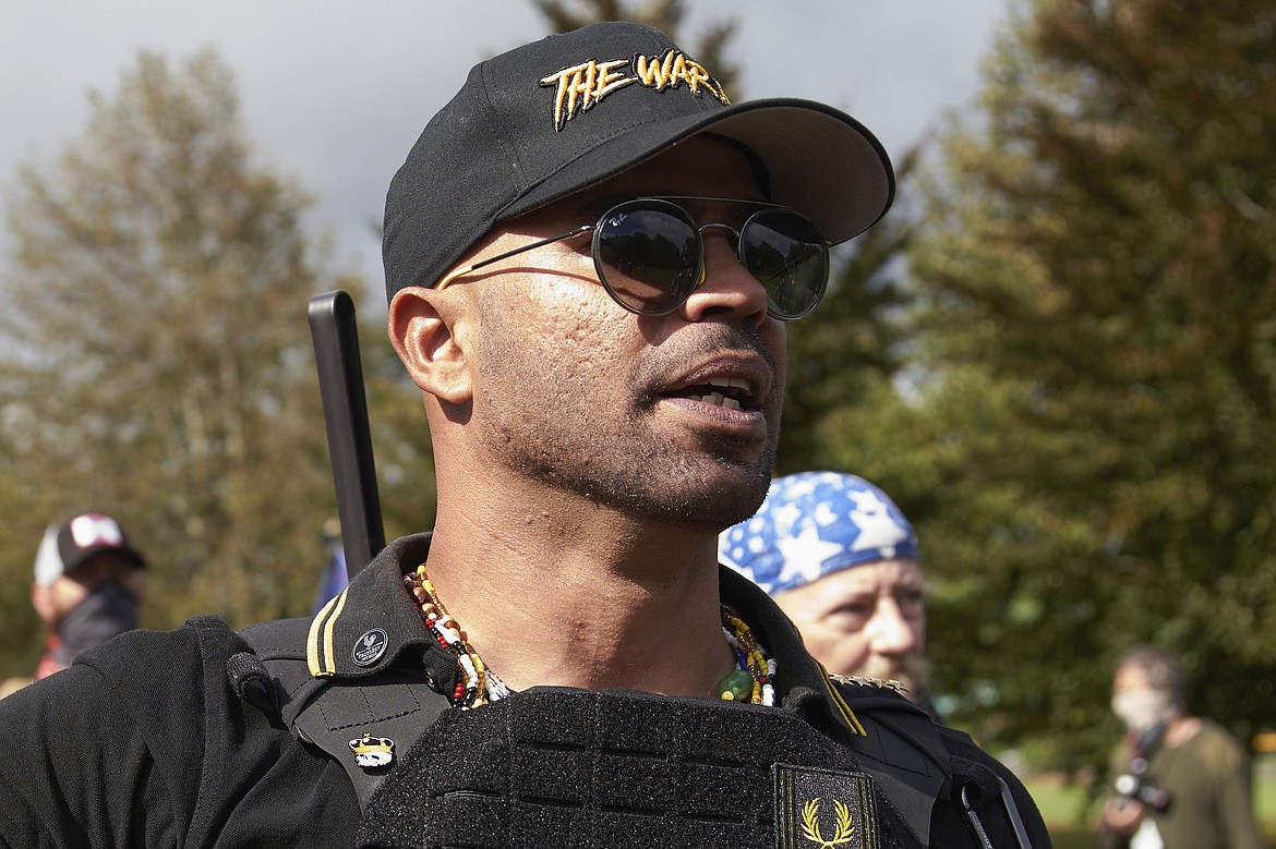 Proud Boys leader Enrique Tarrio speaks at a rally in Delta Park on Sept. 26, 2020, in Portland, Ore. (AP Photo/Allison Dinner, File)