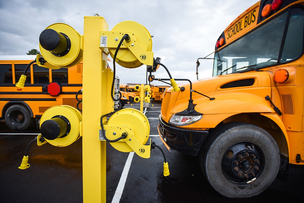 Power stations for the school buses' block heaters line the parking lot outside Kalispell Public Schools' new transportation building on Wednesday, Aug. 30. (Casey Kreider/Daily Inter Lake)