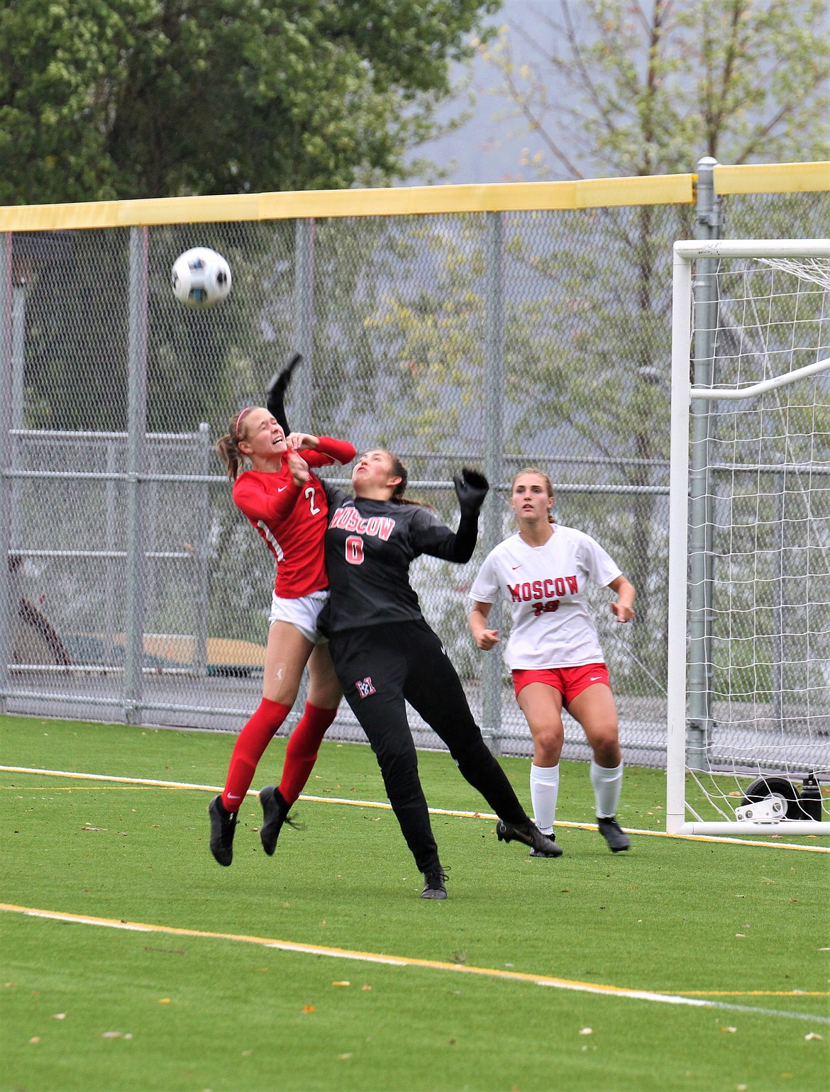 Sandpoint's Marlee McCrum nearly heads in a goal after colliding with Moscow goalkeeper Makai Rauch during the first half on Wednesday.