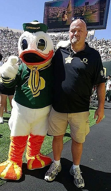 Rollin Putzier visits with the mascot at his alma mater, University of Oregon.