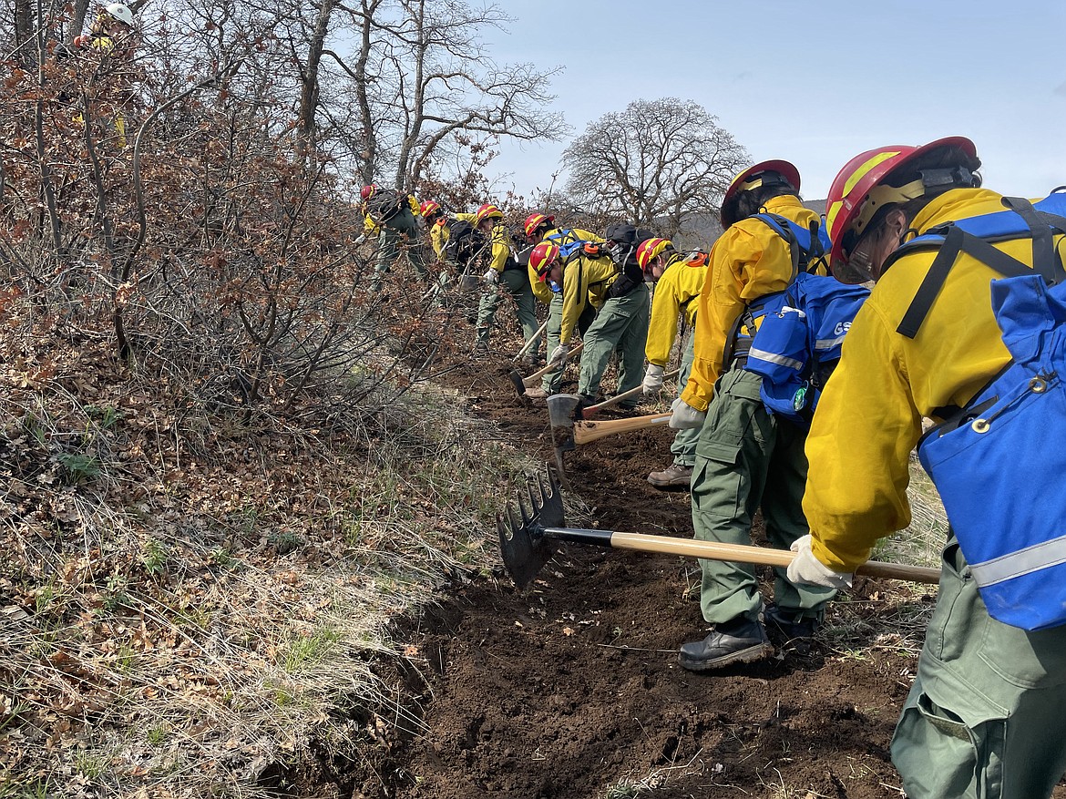 Job Corps students train for firefighting duty. Students at the Columbia Basin Job Corps Center do their training on top of their regular trade program.