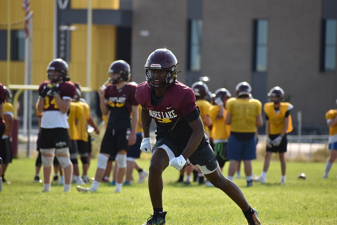 Moses Lake senior Joel Middleton breaks out of his stance during a play in practice.