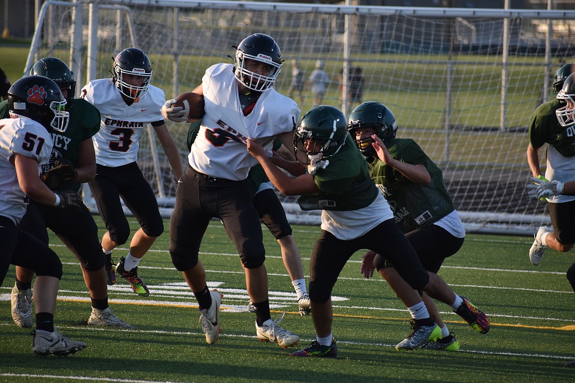 Quincy defenders take down an Ephrata running back during the jamboree.