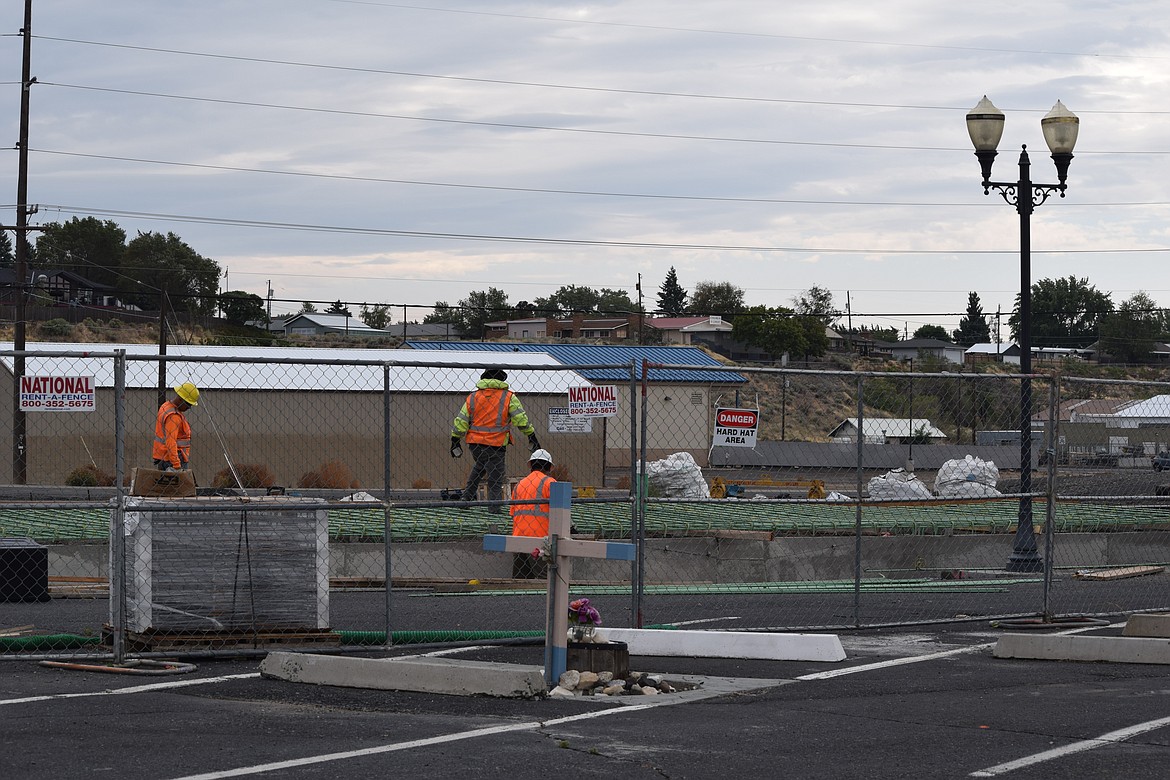 A construction crew works on the new Amtrak loading dock at the Ephrata Transit Center. A woman trying to navigate her way around the construction site was struck by a BNSF train Tuesday afternoon and suffered serious but non-life-threatening injuries.