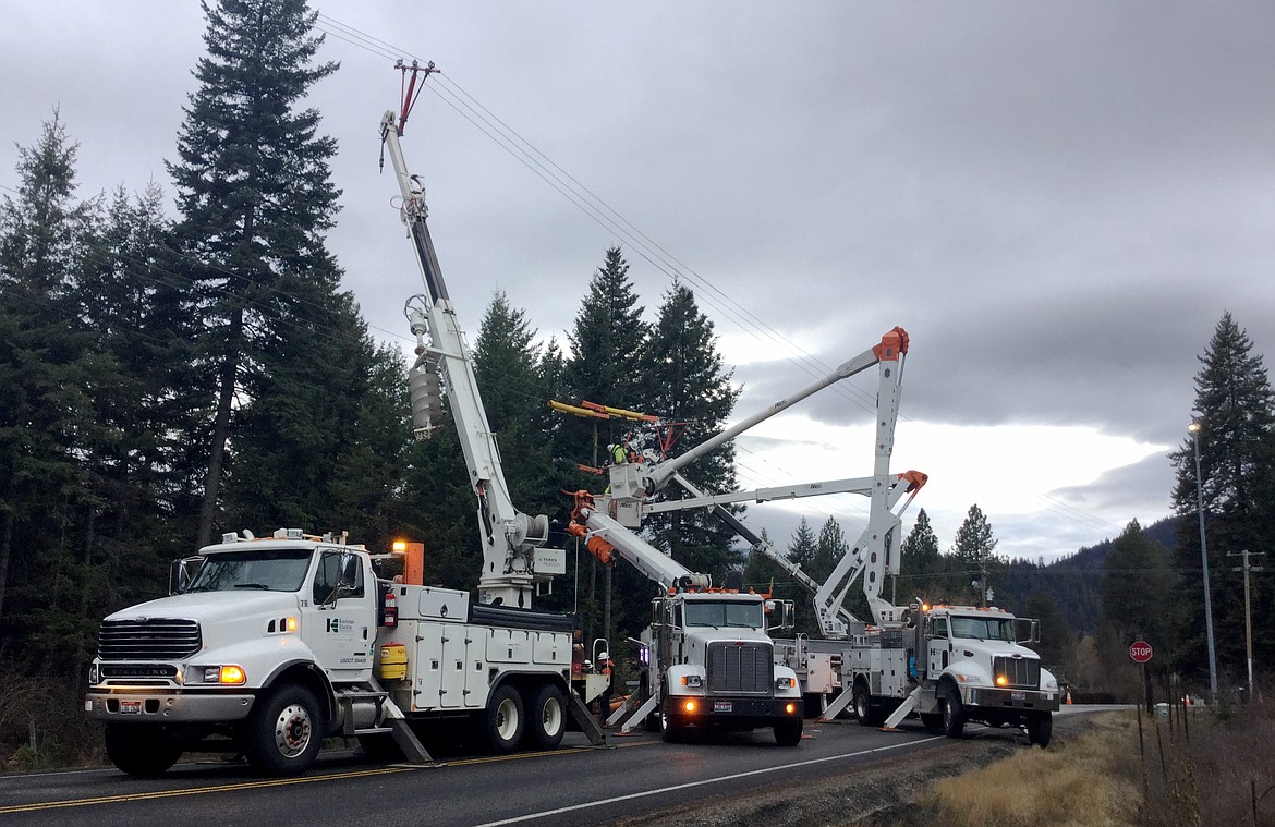 Kootenai Electric Cooperative crews work on a power line. Line maintenance and ensuring cabling won't interact with trees or other items helps prevent fires and mitigates the risk of outages.