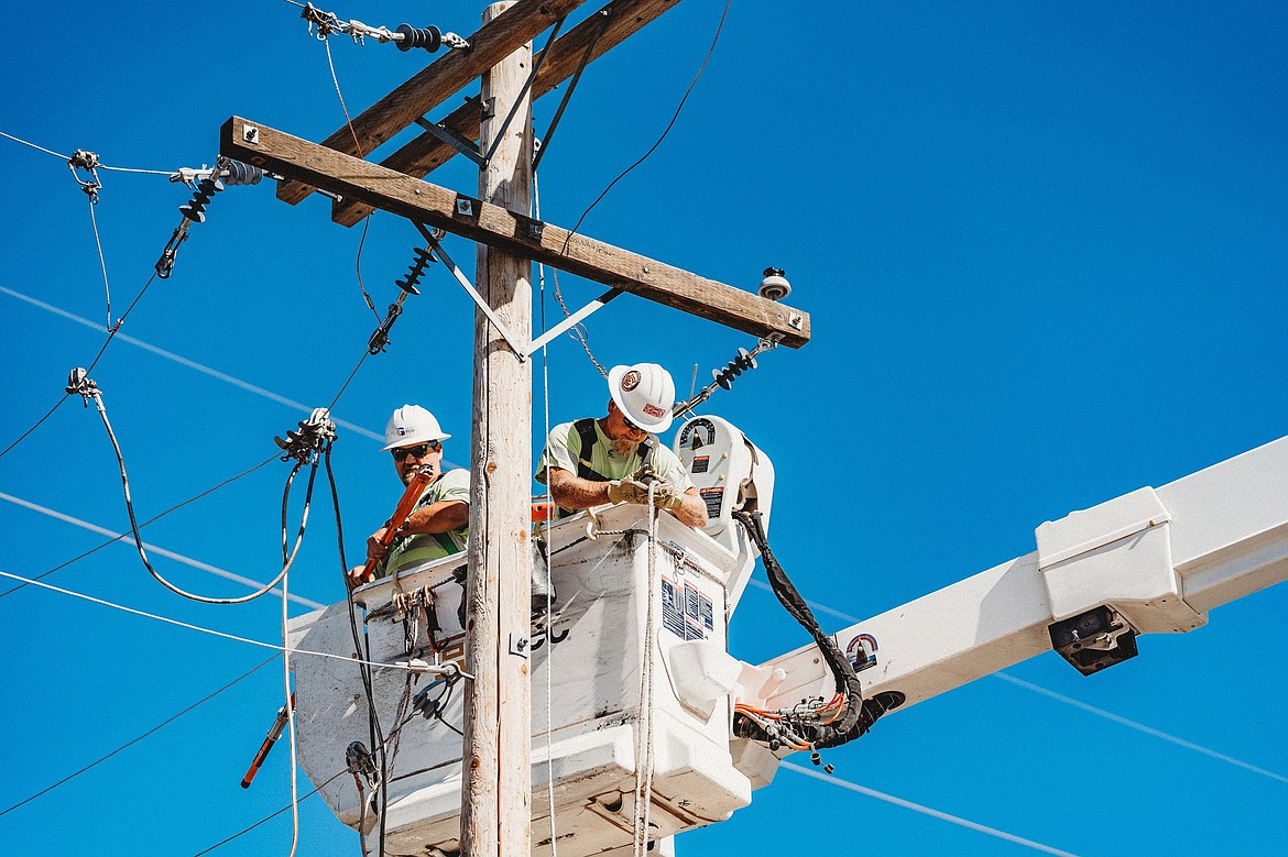 Grant County PUD crews repair a transmission line. Keeping lines in good repair reduces fire risk, according to utility officials from throughout the region.