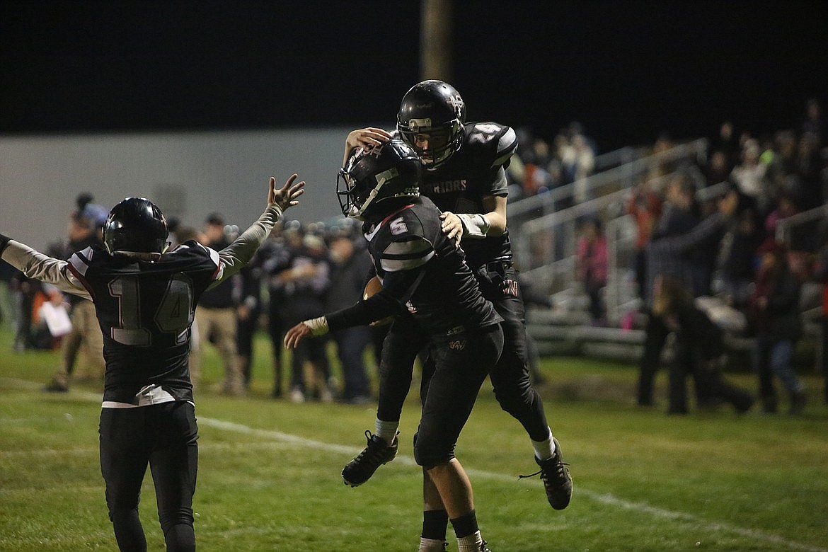 ACH’s Grayson Beal (5) and Caden Correia (24) celebrate after a late touchdown scored against Wilbur-Creston-Keller last season.