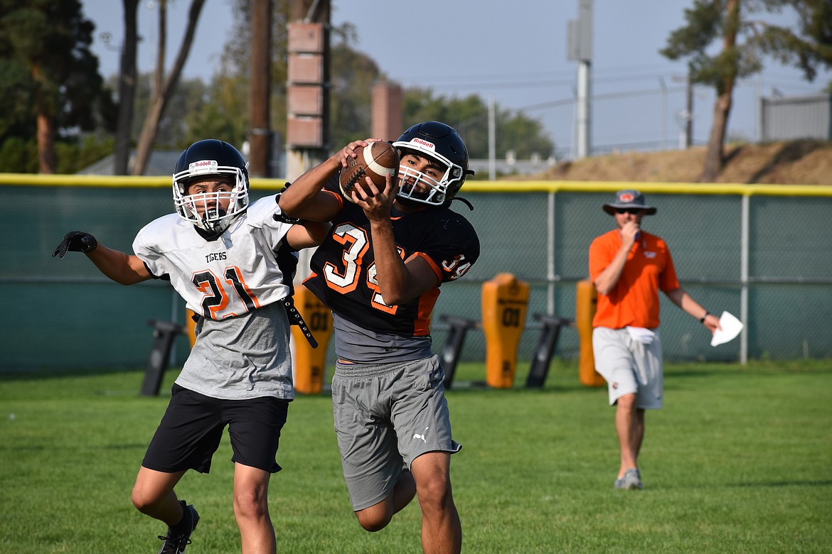 Ephrata senior Max Placido jumps in front of a route and intercepts a pass during practice.