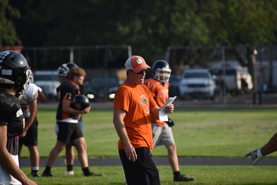 Ephrata Head Coach Patrick Mitchell calls out a play during a team session of practice. Mitchell is entering his second season as head coach of the Tigers, and won co-Coach of the Year honors in the Central Washington Athletic Conference last season.