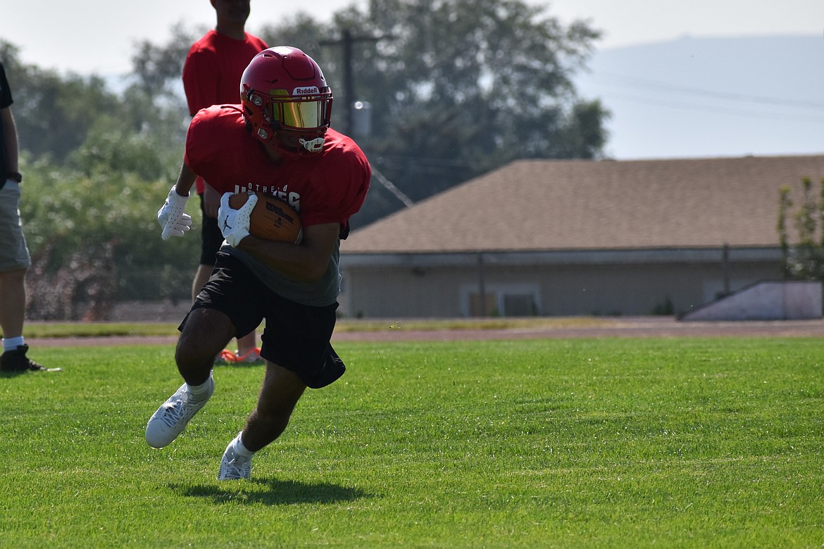 Othello senior Alex Mendez returns a punt during a Huskie practice on Aug. 25. Mendez is one of Othello’s two returning all-league players in 2023, as the team graduated 22 players in 2022.