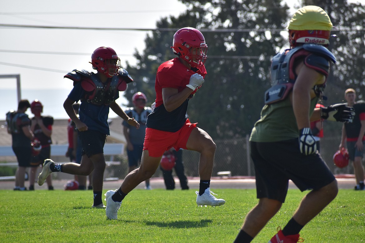 Othello senior Steve Carmona runs down the field on kickoff coverage. The senior said if everybody plays their role, the Huskies can have a strong defense again in 2023.