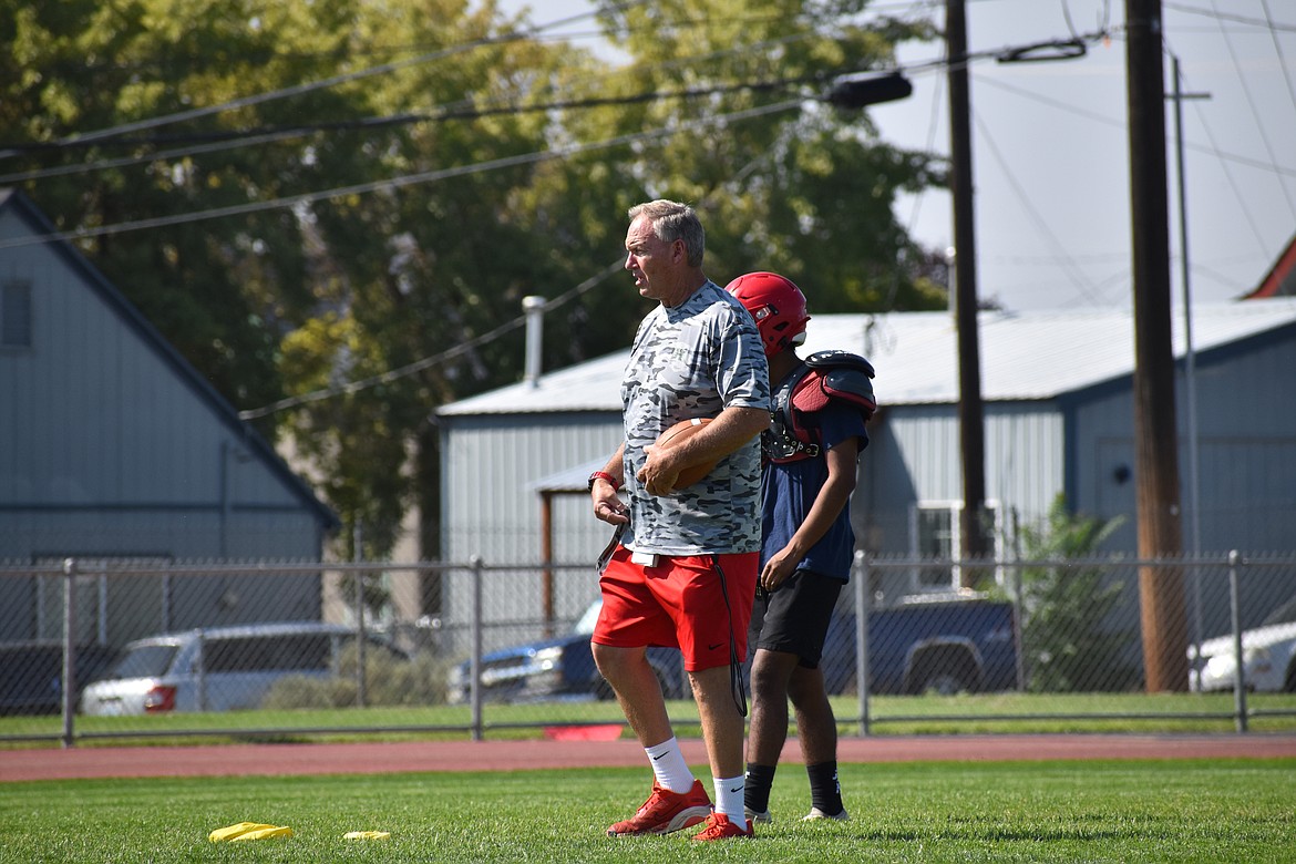 Othello Head Coach Roger Hoell talks to players during practice on Aug. 30. Hoell won the Central Washington Athletic Conference’s co-Coach of the Year in 2022.