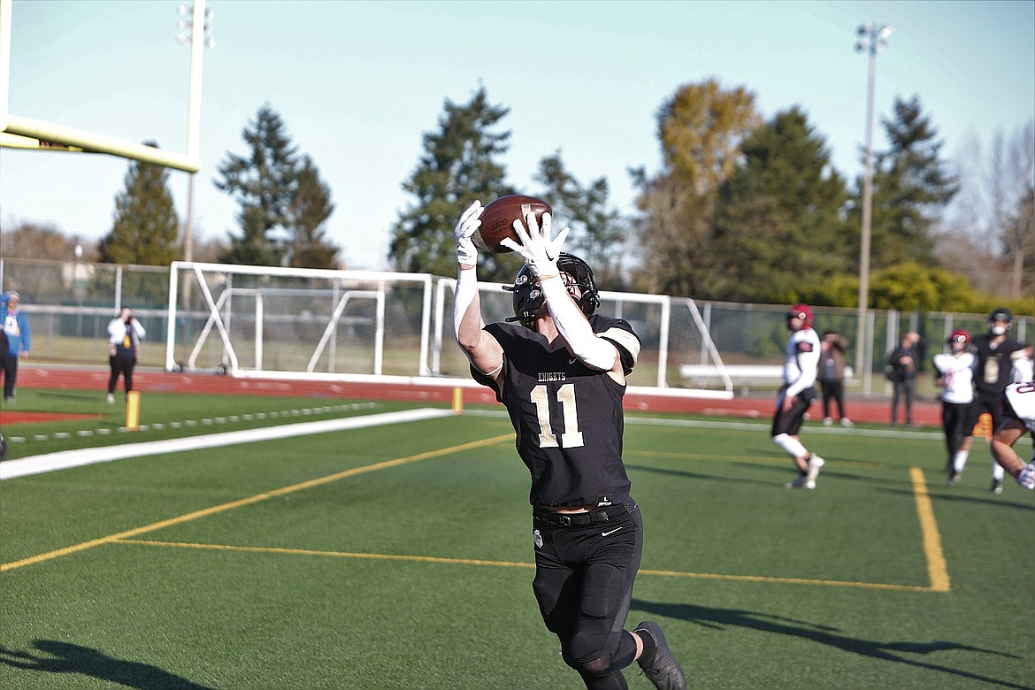 Royal sophomore Lance Allred catches a touchdown pass in the state championship game against Mt. Baker. Allred, a junior now, is playing quarterback for the Knights in 2023.