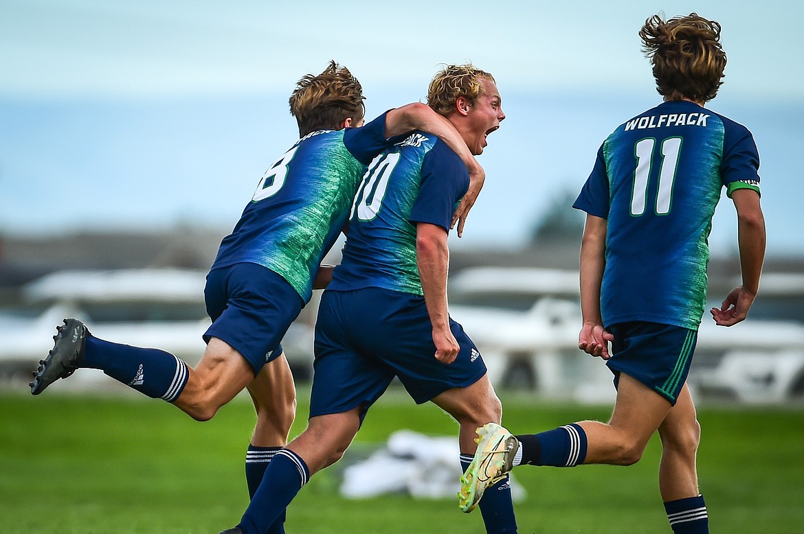 Glacier's Hunter Lisowski (10) celebrates with teammates after a goal in the second half against Missoula Hellgate at Glacier High School on Thursday, Aug. 31. (Casey Kreider/Daily Inter Lake)