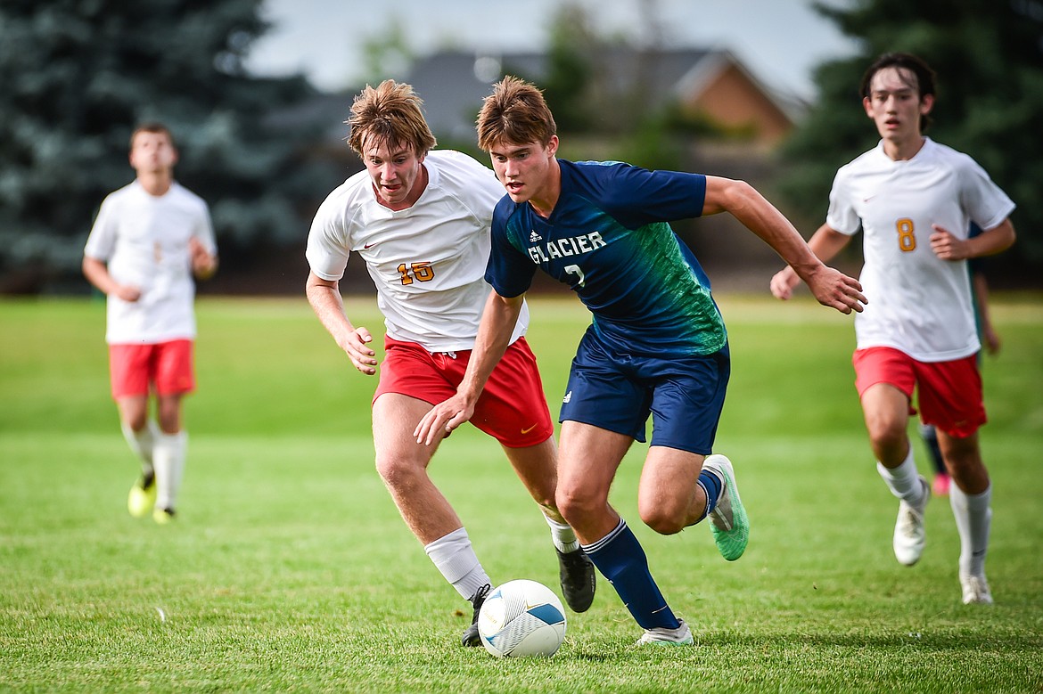 Glacier's Joey Paolini (7) works the ball upfield in the first half against Missoula Hellgate at Glacier High School on Thursday, Aug. 31. (Casey Kreider/Daily Inter Lake)