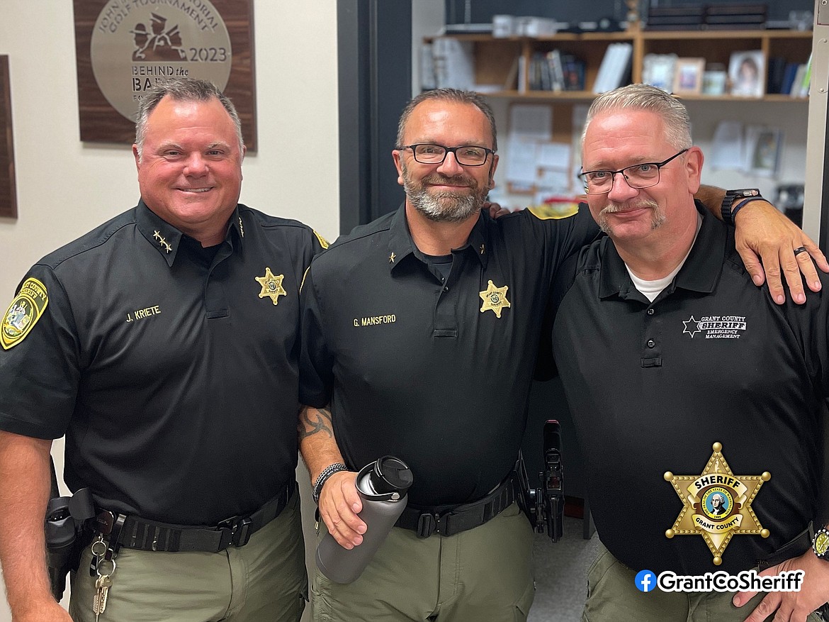 The Grant County Sheriff's Office employee of the month for August is Chief Deputy of Investigations Gary Mansford, center. Mansford was nominated by GCSO Public Information Officer Kyle Foreman, right, for Mansford's recognition of the importance of communications personnel in public emergencies to build transparency and trust in the department, a factor Sheriff Joe Kriete, left, said is important to the agency.