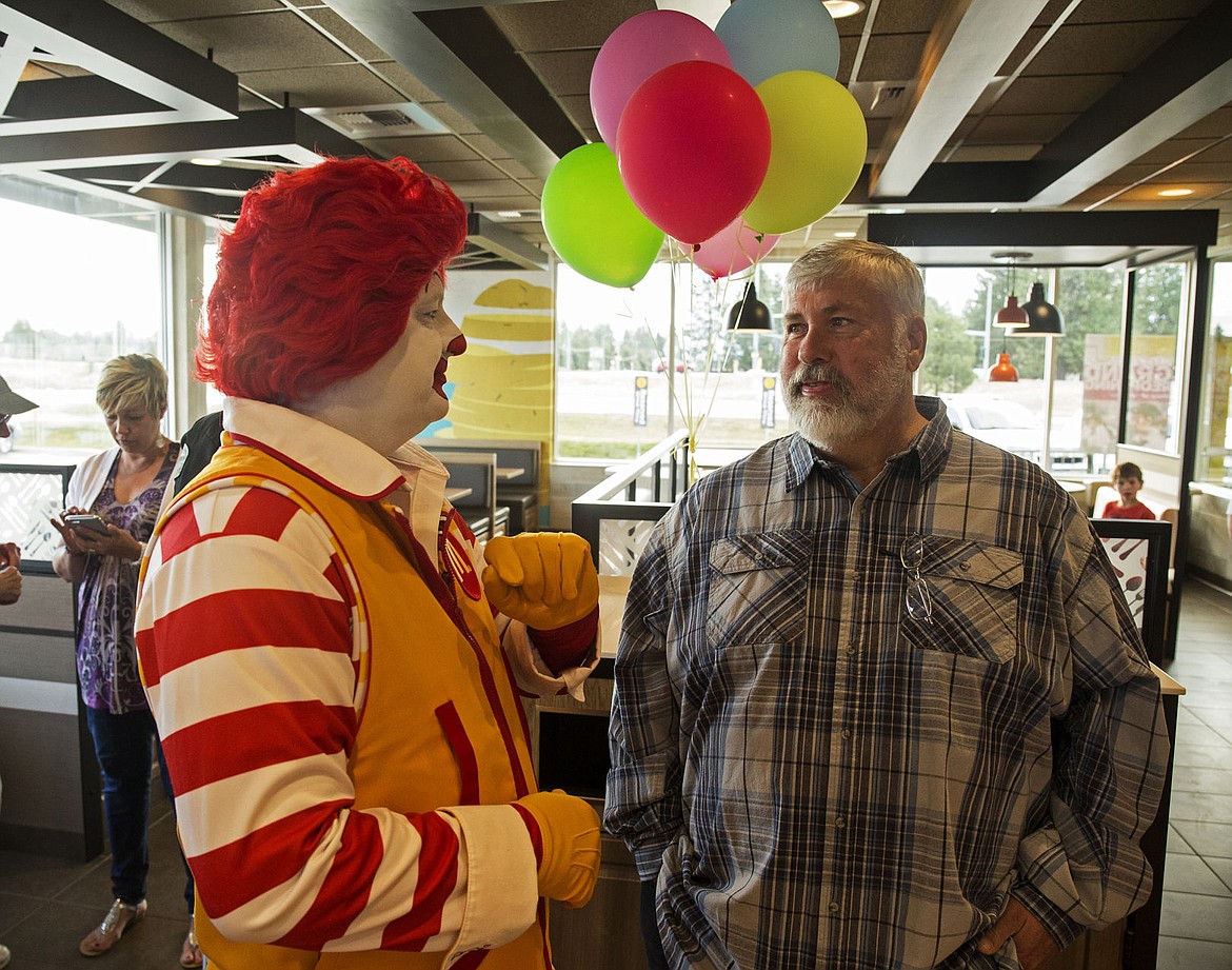 Ronald McDonald greets Rathdrum Mayor Vic Holmes in July 2017 during a campaign event to raise funds for a water feature memorial in McEuen Park to honor fallen Coeur d'Alene Police Sgt. Greg Moore. Holmes has announced he will not seek re-election this fall.