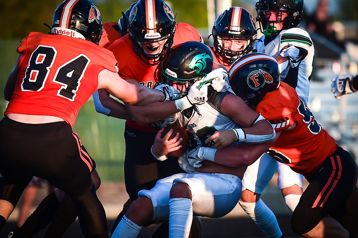 Flathead defenders stop a run in the first half at Legends Stadium on Friday, Sept. 1. (Casey Kreider/Daily Inter Lake)
