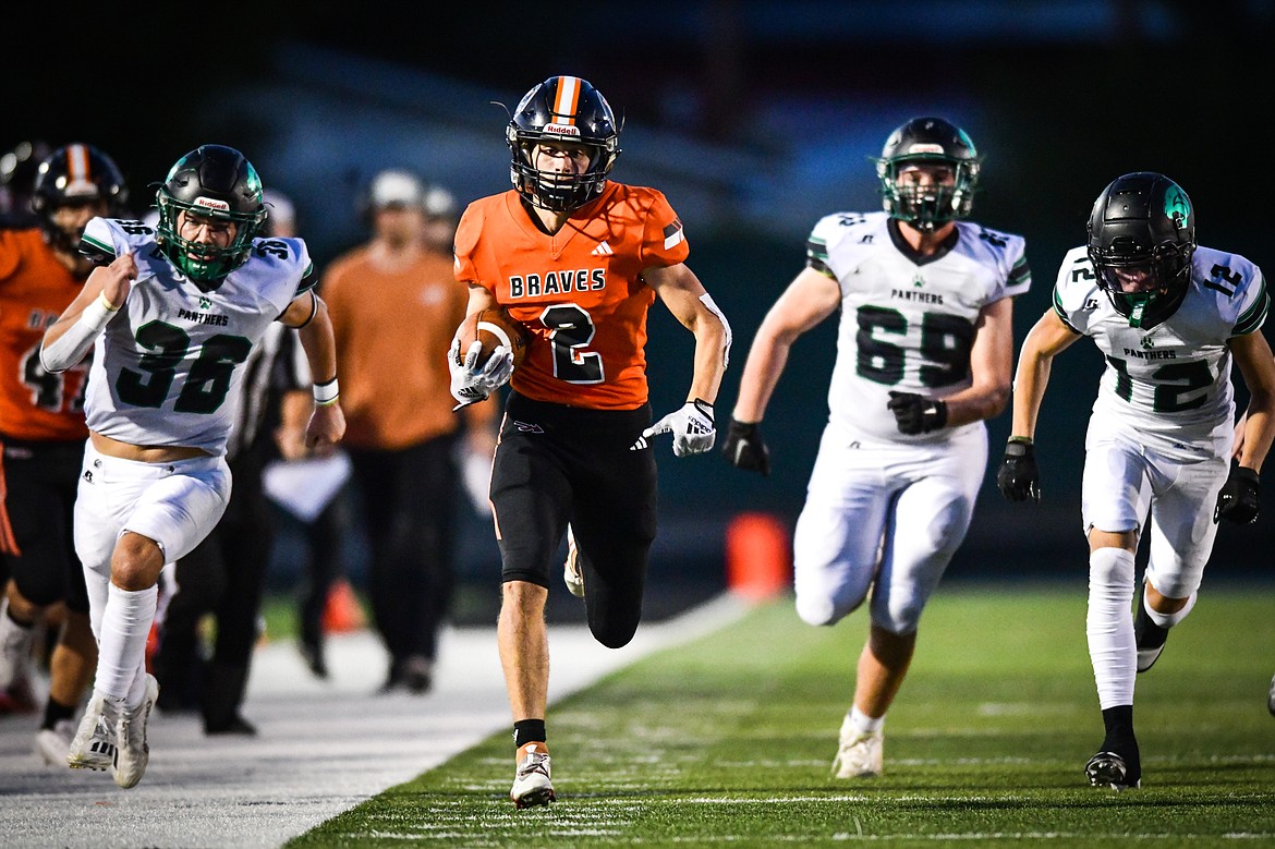 Flathead wide receiver Ben Bliven (2) heads down the sideline on a run in the third quarter against Belgrade at Legends Stadium on Friday, Sept. 1. (Casey Kreider/Daily Inter Lake)