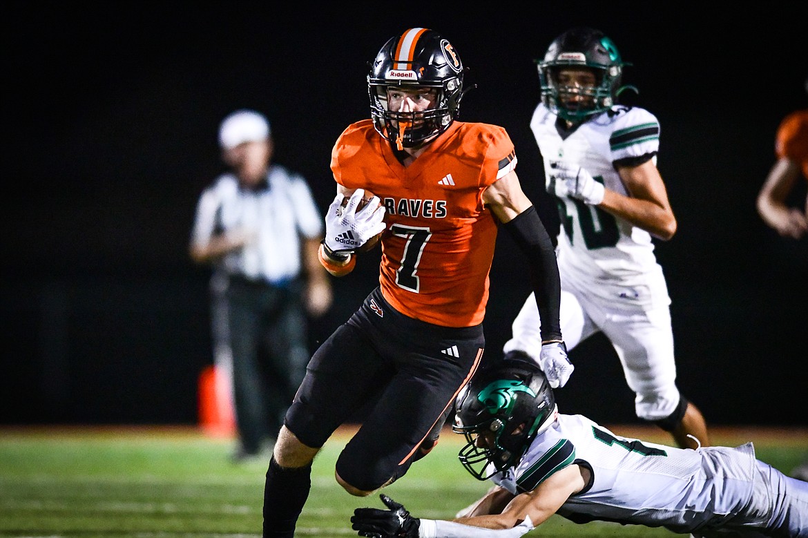 Flathead wide receiver Stephen Riley (7) picks up yardage on a reception in the fourth quarter against Belgrade at Legends Stadium on Friday, Sept. 1. (Casey Kreider/Daily Inter Lake)