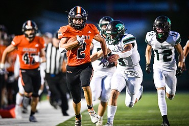 Flathead wide receiver Ben Bliven (2) heads down the sideline on a run in the third quarter against Belgrade at Legends Stadium on Friday, Sept. 1. (Casey Kreider/Daily Inter Lake)