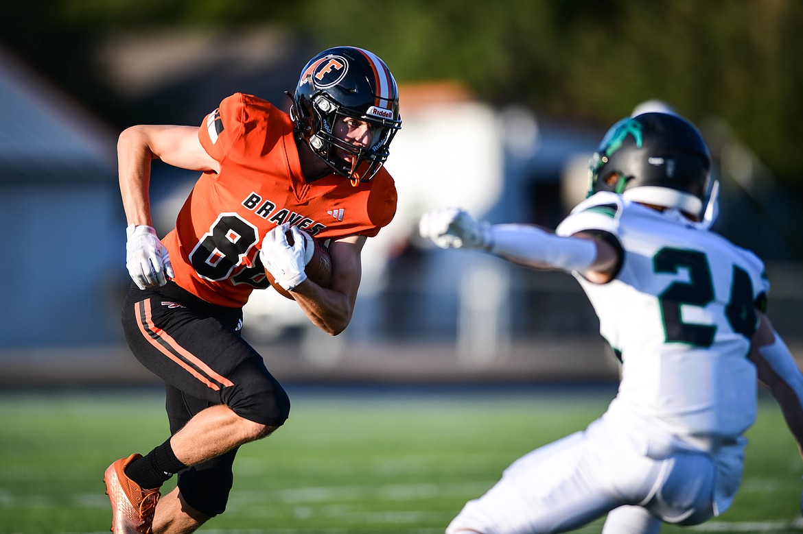 Flathead wide receiver Brody Thornsberry (88) looks for running room after a reception in the first quarter against Belgrade at Legends Stadium on Friday, Sept. 1. (Casey Kreider/Daily Inter Lake)