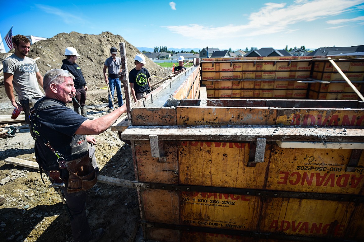 Kalispell Student Built Homes instructor Brock Anderson talks to his students at a home site build on Northridge Way in Kalispell on Friday, Sept. 1. (Casey Kreider/Daily Inter Lake)