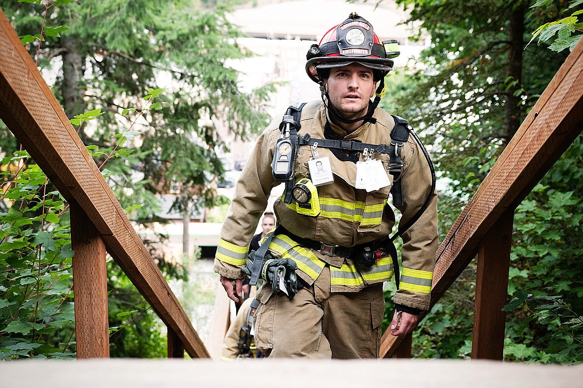 Shoshone County Fire Department No. 1 Lt. Victor Malsom makes his way up the stairs during the 2019 event in Wallace.