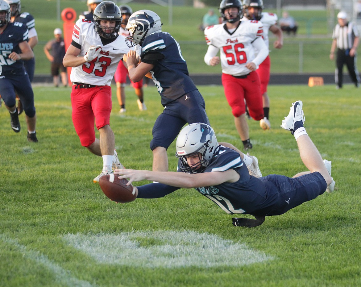 MARK NELKE/Press
Lake City quarterback Avrey Cherry dives for the end zone, as teammate Hunter Profumo blocks, in the first half against North Central on Friday night at Lake City.