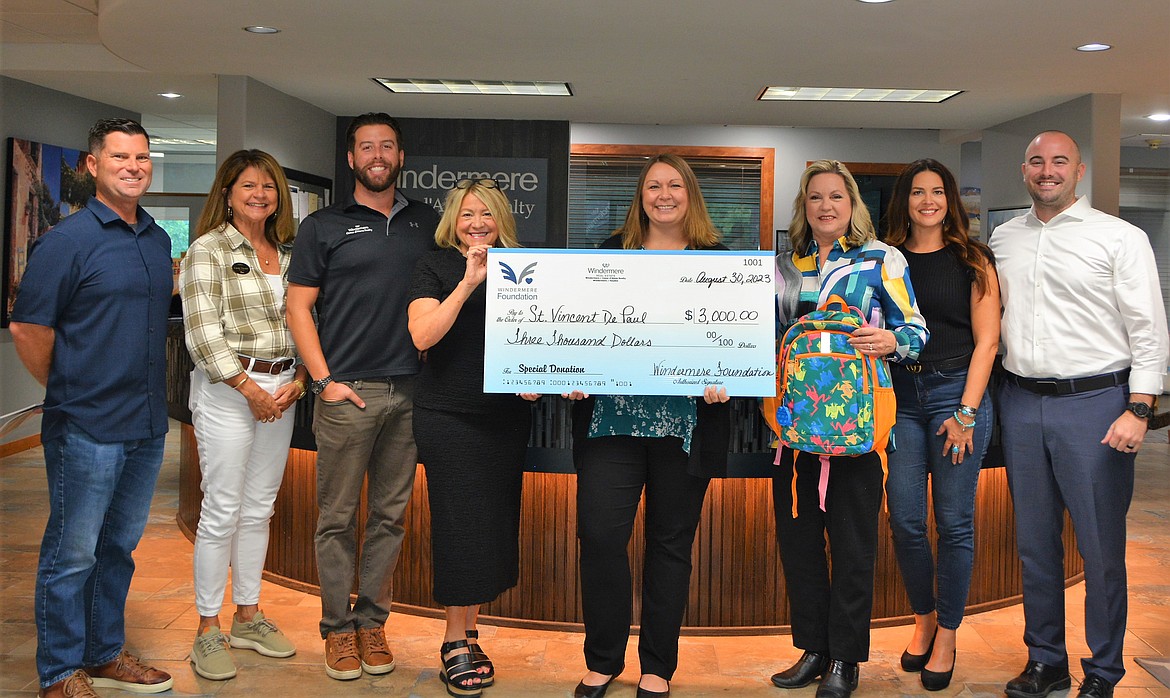 The Windermere Foundation provided $3,000 to the St. Vincent De Paul ICARE agency for backpack/school supply program for the 2023-2024 school year during a check presentation Thursday. Front row, from left: Windermere Coeur d'Alene agents Corey Ray and Candy Taranto; Post Falls Windermere agent Aron Tesulov; Hayden Windermere agent Jose Krahn; Taryn Molitor, ICARE, St. Vincent De Paul of North Idaho; and Julie Patterson, Lisa Biondo and Dan Hummer, Windermere Coeur d'Alene agents.