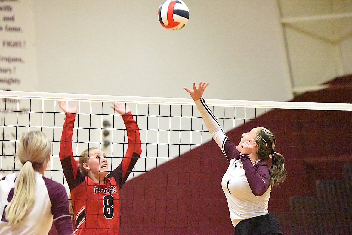 Noxon's Maygan Swanson battles Troy's Autumn Fisher at the net during a match Thursday, Aug. 31 in Troy. The Lady Red Devils won in four sets. (Scott Shindledecker/The Western News)