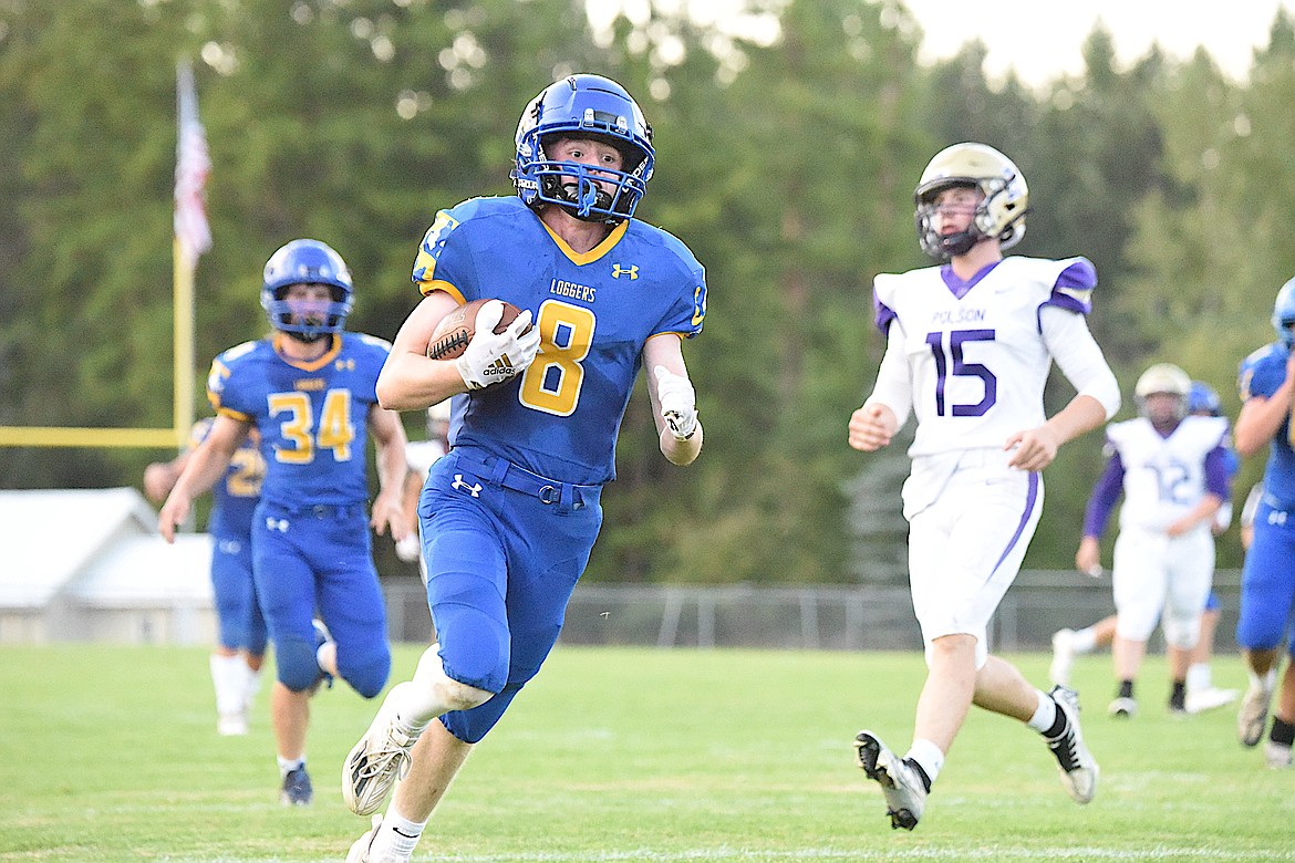 Libby's Ryan Beagle crosses the goal line after intercepting a Polson pass and returning it for a touchdown against the Pirates on Sept. 1 at Logger Stadium. (Scott Shindledecker/The Western News)