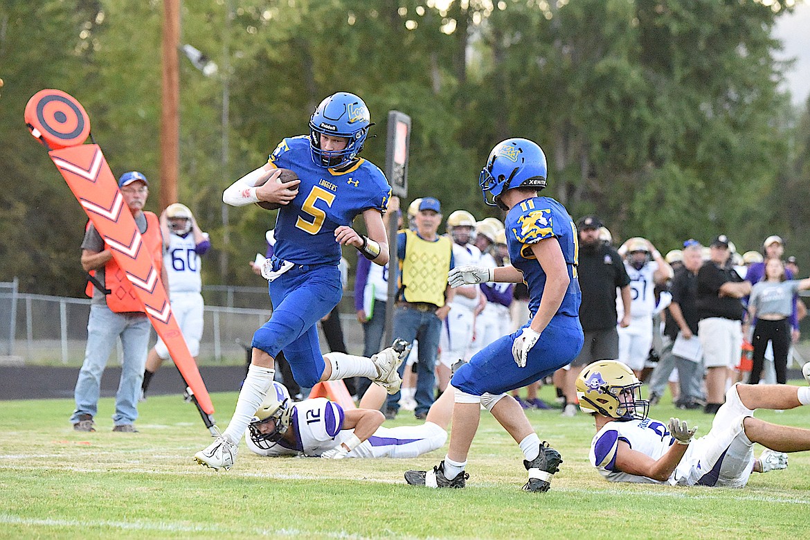 Libby's Tristan Andersen makes a good gain against the Pirates on Sept. 1 at Logger Stadium. (Scott Shindledecker/The Western News)