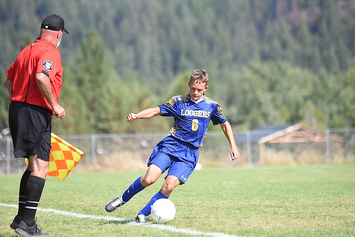 Libby's Colter Anderson maintains control of the ball against Stevensville in a game on Sept. 2 at J. Neils Memorial Park. (Scott Shindledecker/The Western News)