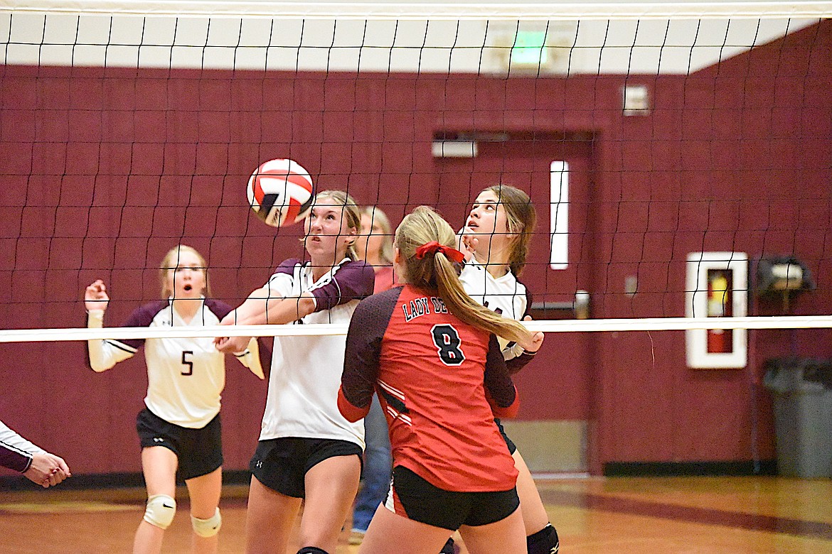 Troy's Jaylee Meyers plays at the net during the Lady Trojan's home opener on Aug. 31 against Noxon. (Scott Shindledecker/The Western News)