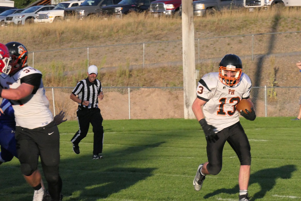 Plains running back Zephaniah Dines looks for running room against Superior during their game Friday night in Superior, won by the Bobcats 58-8. (Chuck Bandel/VP-MI)