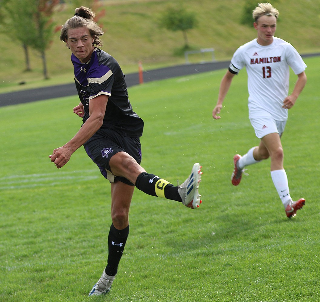 Pirate Ashten Nelson slams in a goal against Hamilton during Thursday's soccer game. (Bob Gunderson photo)