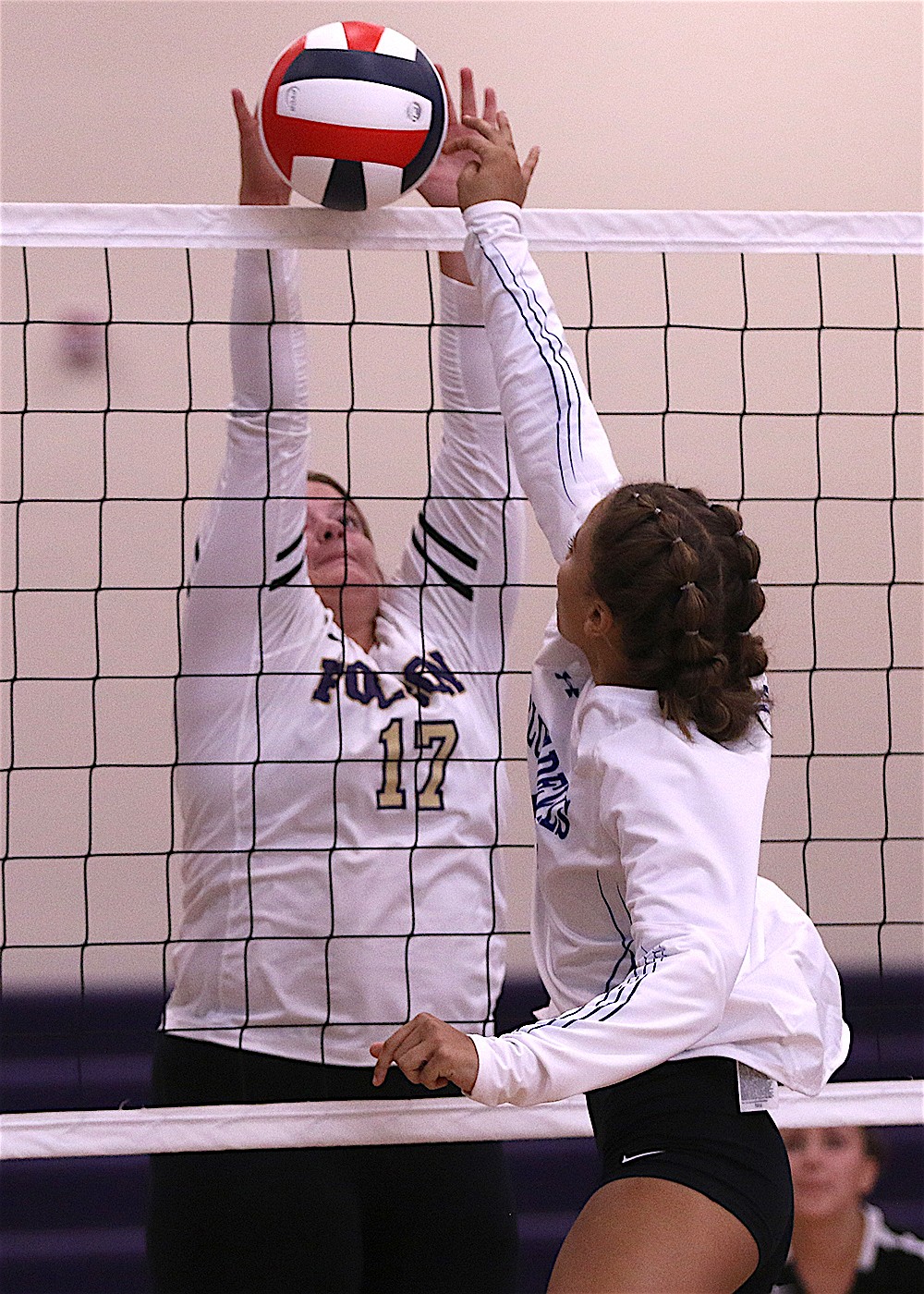 Lady Pirate Avery Starr blocks the ball against Corvallis Saturday. Polson won 3-0. (Bob Gunderson photo)