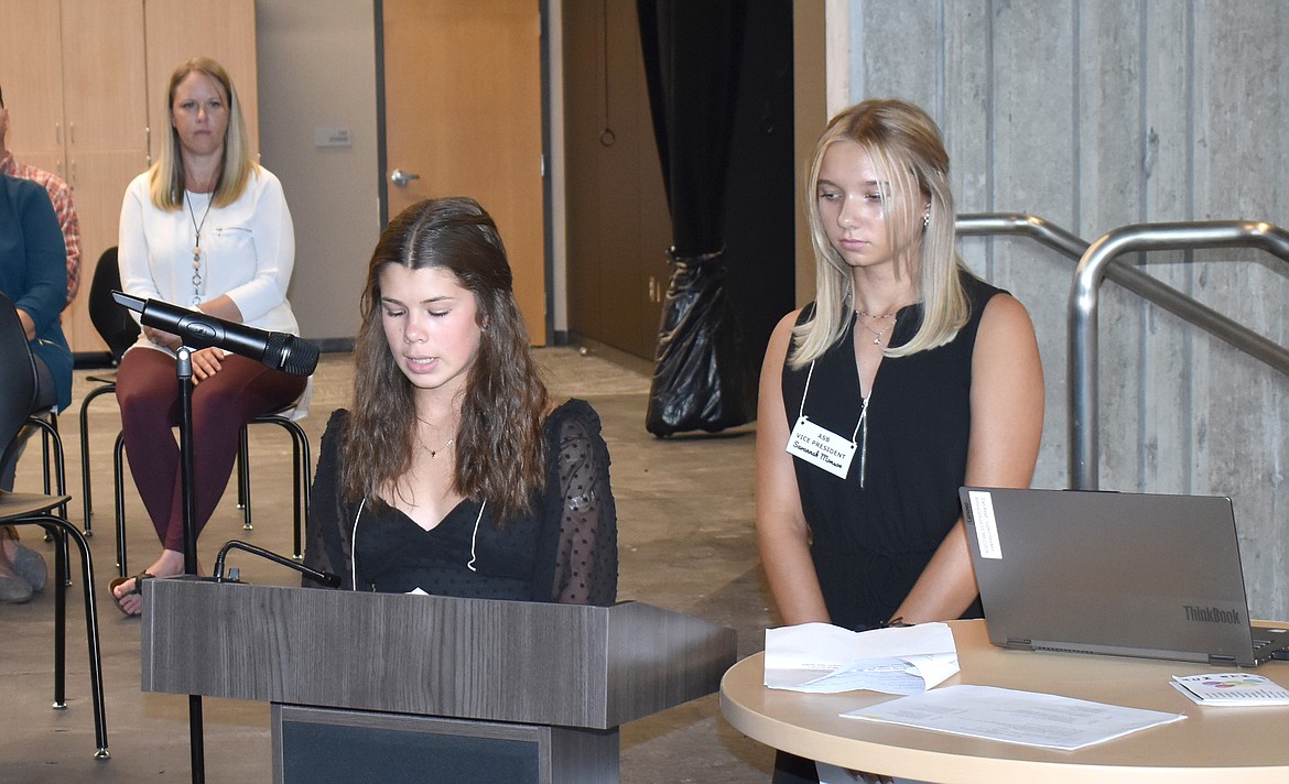 Almira School Associated Student Body President Mallory Isaak, left, thanks donors to the school rebuilding effort as ASB Vice-President Savannah Munson waits her turn to do the same.