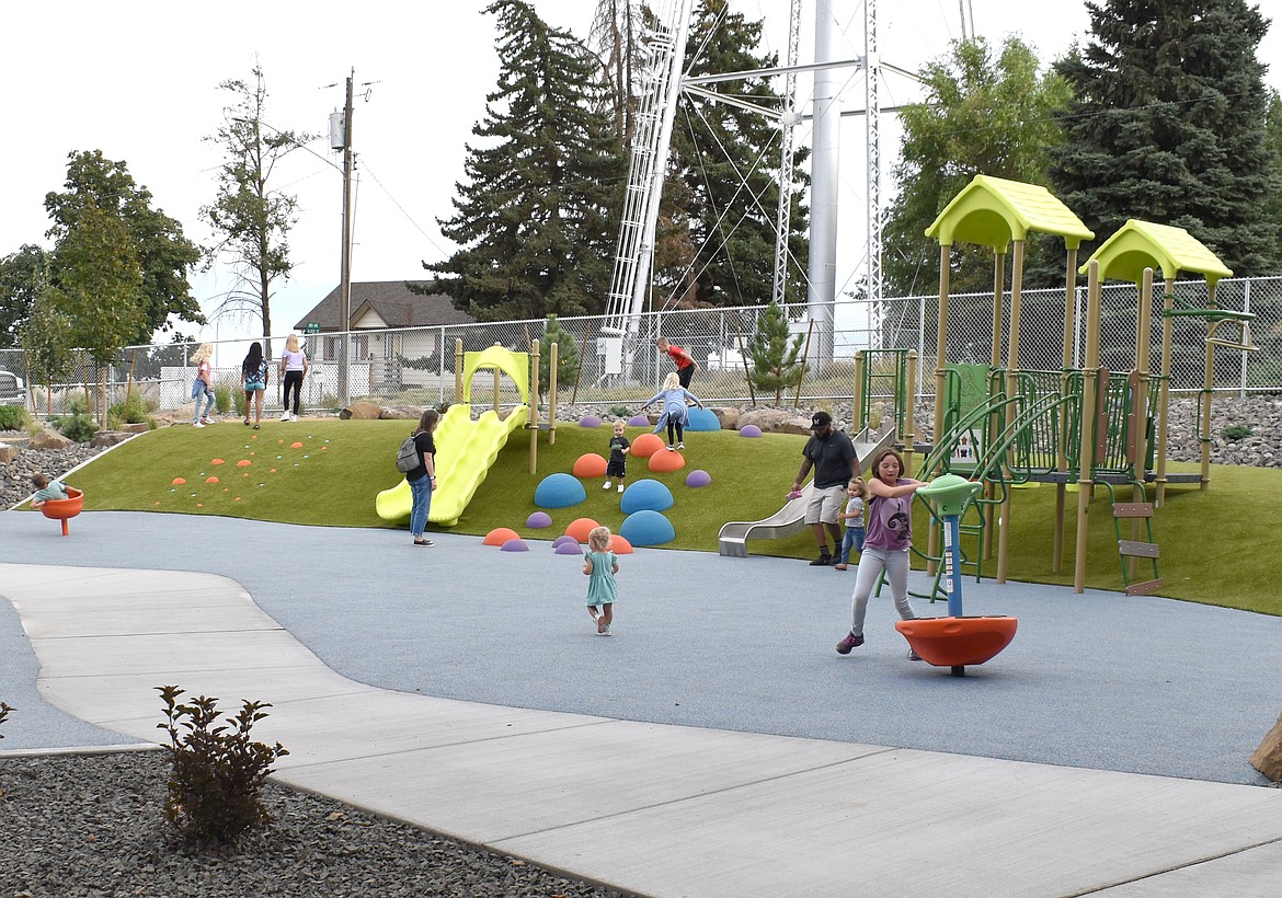 Children play on the playground at the new Almira School, which opened Thursday.