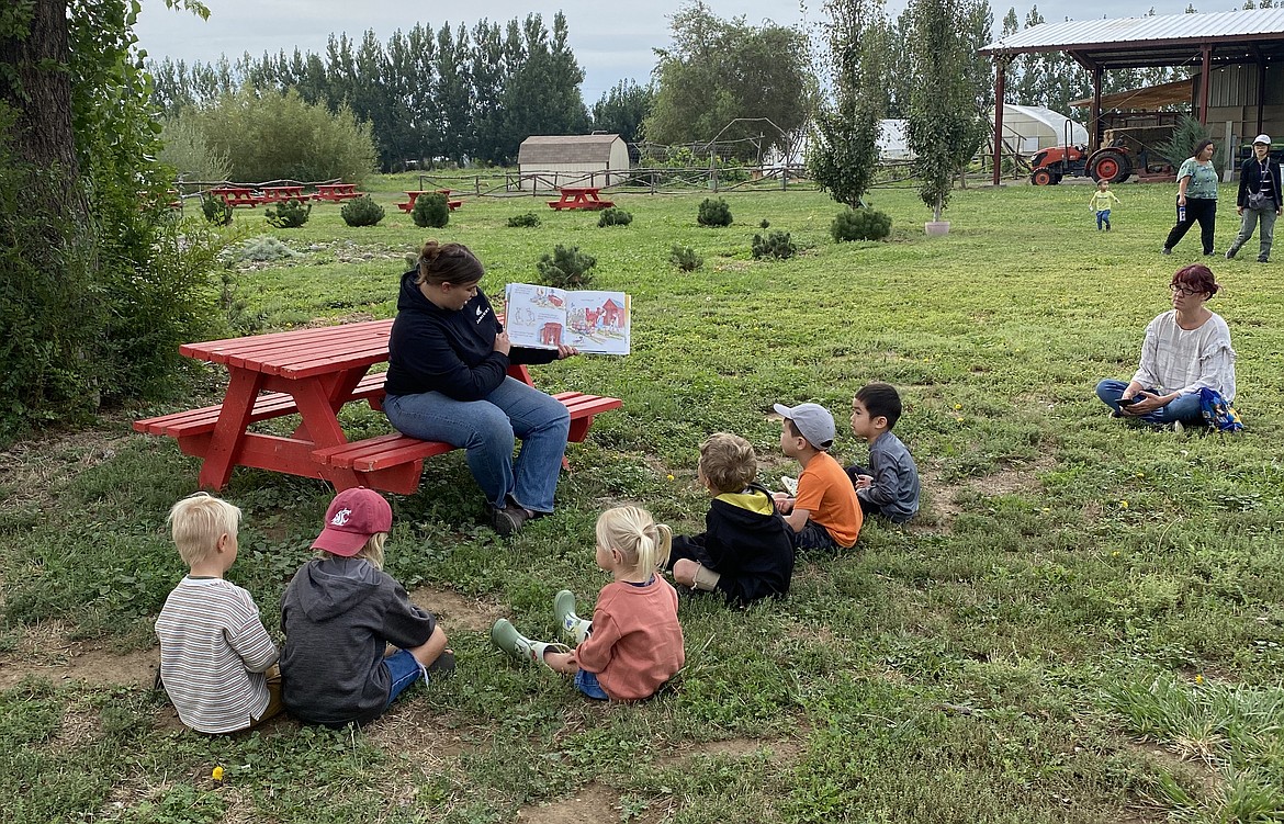 Storytime in the Learning Garden at Cloudview Farm during one of Cloudview’s Lil’ Sprouts Nature Playgroup, one of the programs that will be funded by the Garden Party fundraiser.