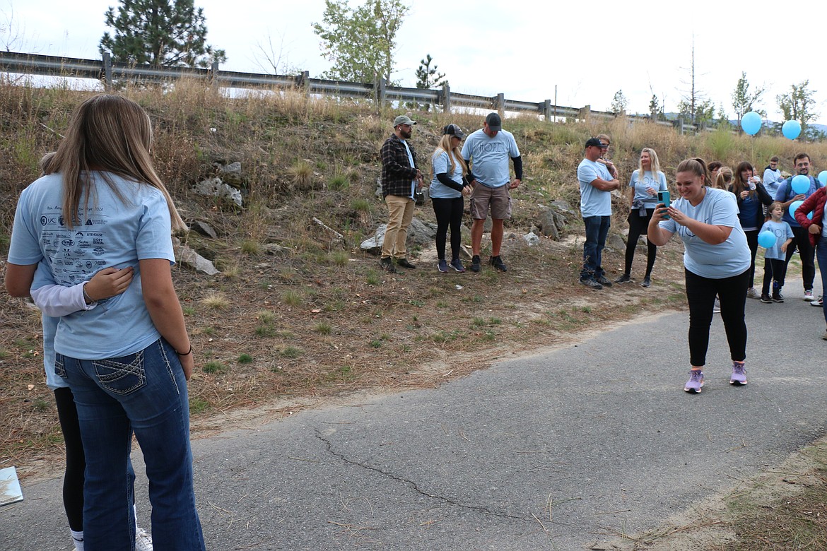 Participants in the 2023 Walk for HOPE get their picture taken at Dog Beach as they wait for the start of the annual event, held Sunday, Sept. 3.