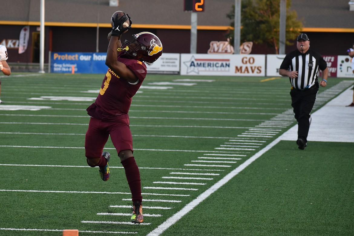 Moses Lake senior Joel Middleton (3) goes up for a catch before toe-tapping his way down the sideline on a 36-yard touchdown reception in the first quarter of the Mavs’ 58-3 win over Ephrata.