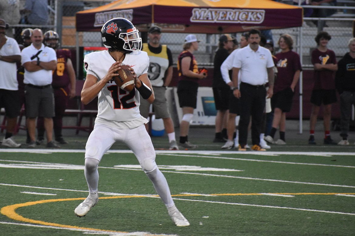 Ephrata sophomore Brady Hendrick (12) drops back to pass in the second quarter against Moses Lake on Friday.